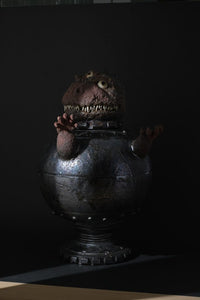Ceramic Artwork Showcase: Multi-Eyed Monster